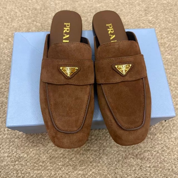 Prada. Shoes - Prada Brown Suede Backless Loafers with Gold Logo